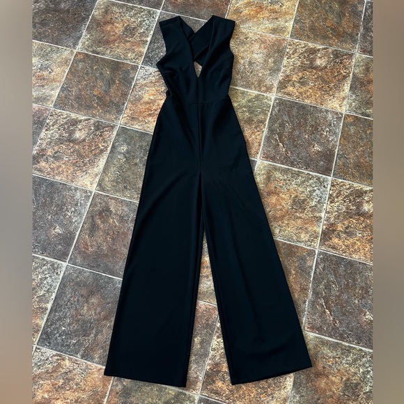 Lulus Pants - Lulu's Chic Black Sleeveless Jumpsuit